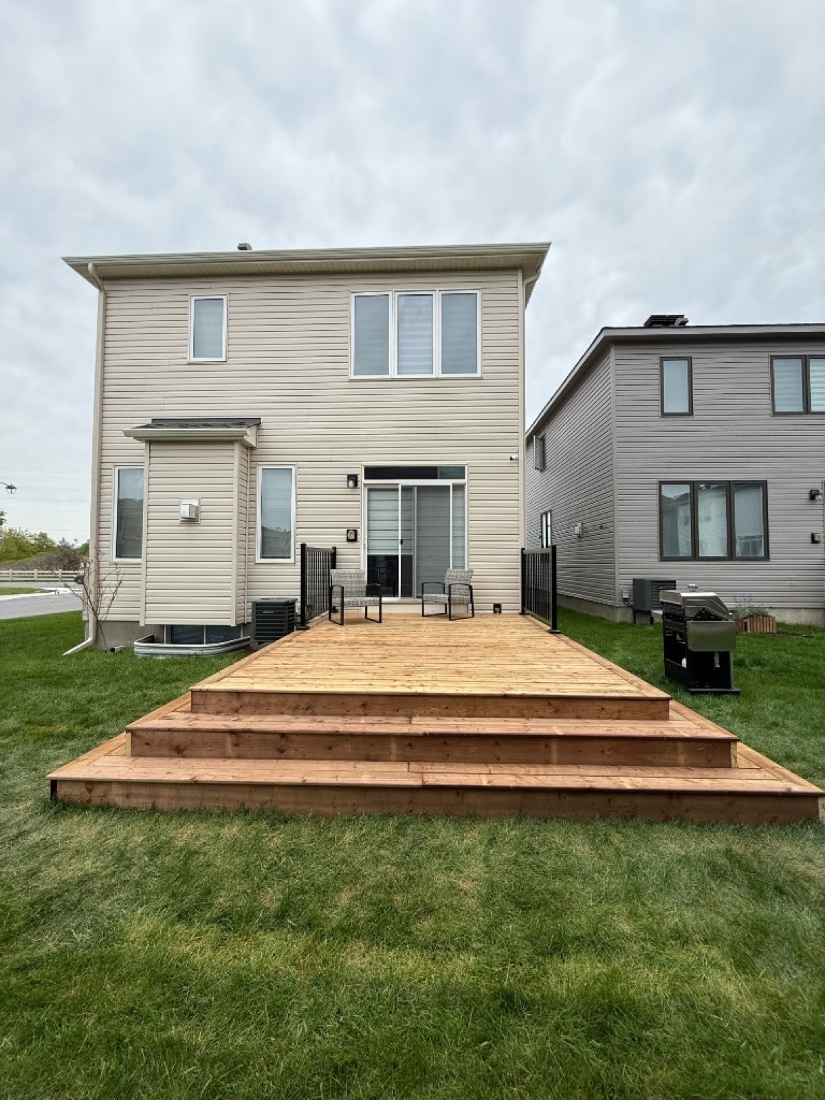 Custom wood deck with wrap-around steps in Ottawa