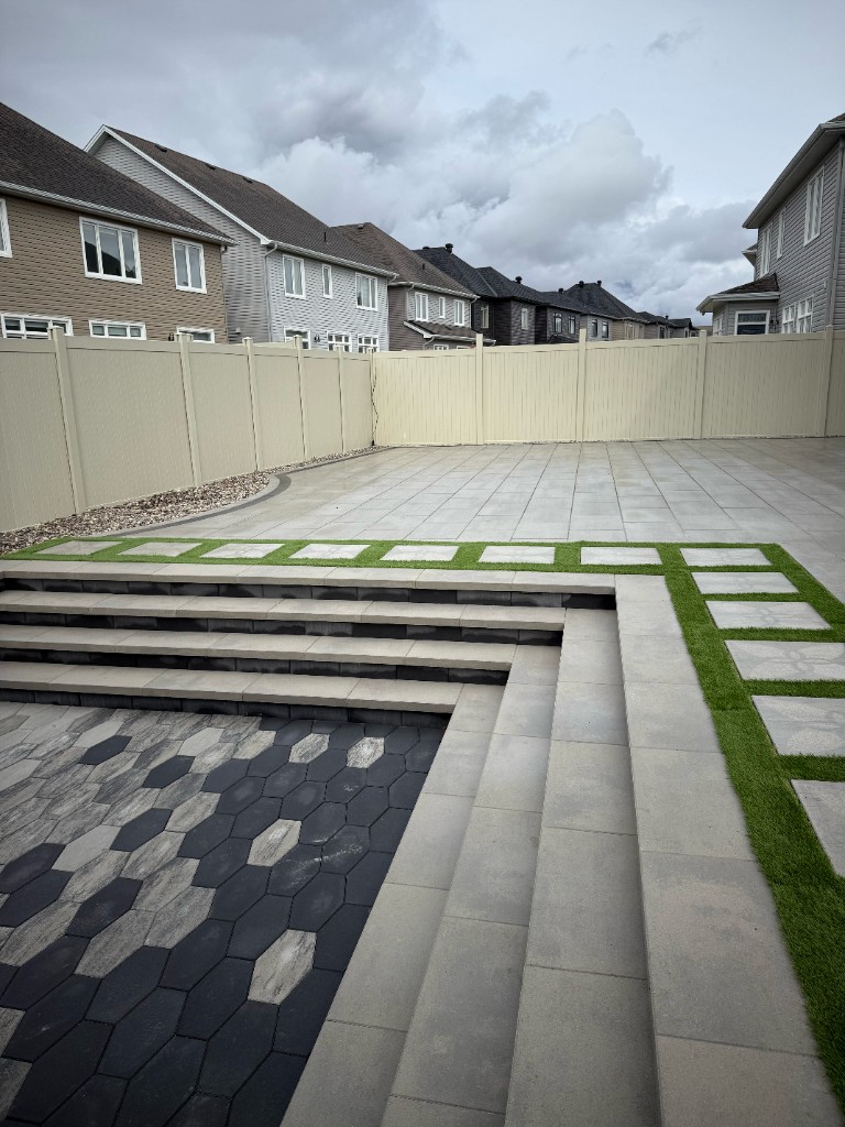 Turf and interlock patio with checkerboard pattern